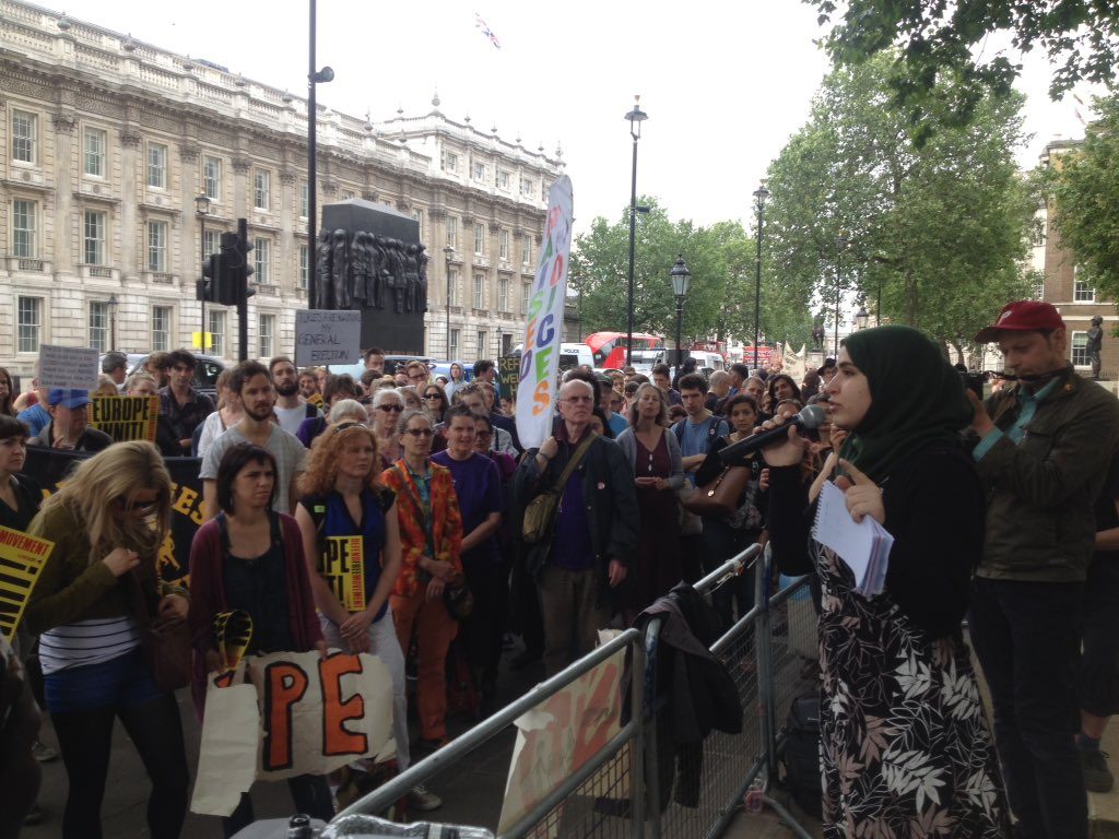 muzna speaking at migrant rights rally